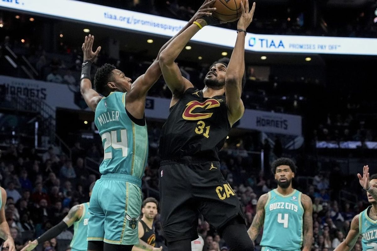 Mar 27, 2024; Charlotte, North Carolina, USA; Cleveland Cavaliers center Jarrett Allen (31) goes up for a shot against Charlotte Hornets forward Brandon Miller (24) during the first quarter at Spectrum Center.