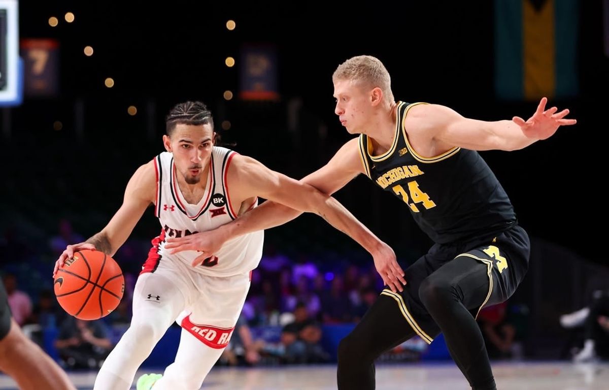 Nov 24, 2023; Paradise Island, BAHAMAS;  Texas Tech Red Raiders guard Pop Isaacs (2) drives to the basket as Michigan Wolverines forward Youssef Khayat (24) defends during the first half at Imperial Arena.