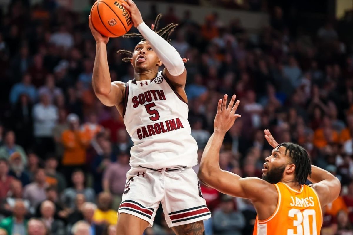 Mar 6, 2024; Columbia, South Carolina, USA; South Carolina Gamecocks guard Meechie Johnson (5) drives past Tennessee Volunteers guard Josiah-Jordan James (30) in the second half at Colonial Life Arena.