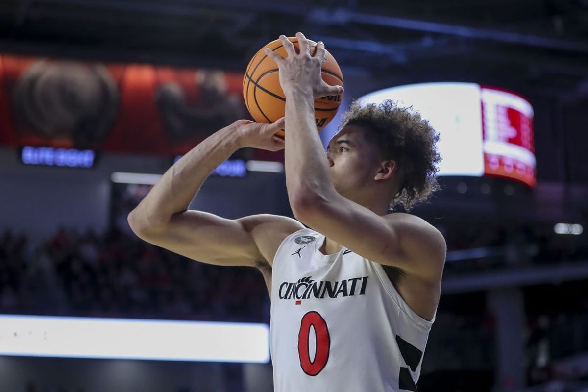 Feb 13, 2024; Cincinnati, Ohio, USA; Cincinnati Bearcats guard Dan Skillings Jr. (0) shoots against the Iowa State Cyclones in the second half at Fifth Third Arena.