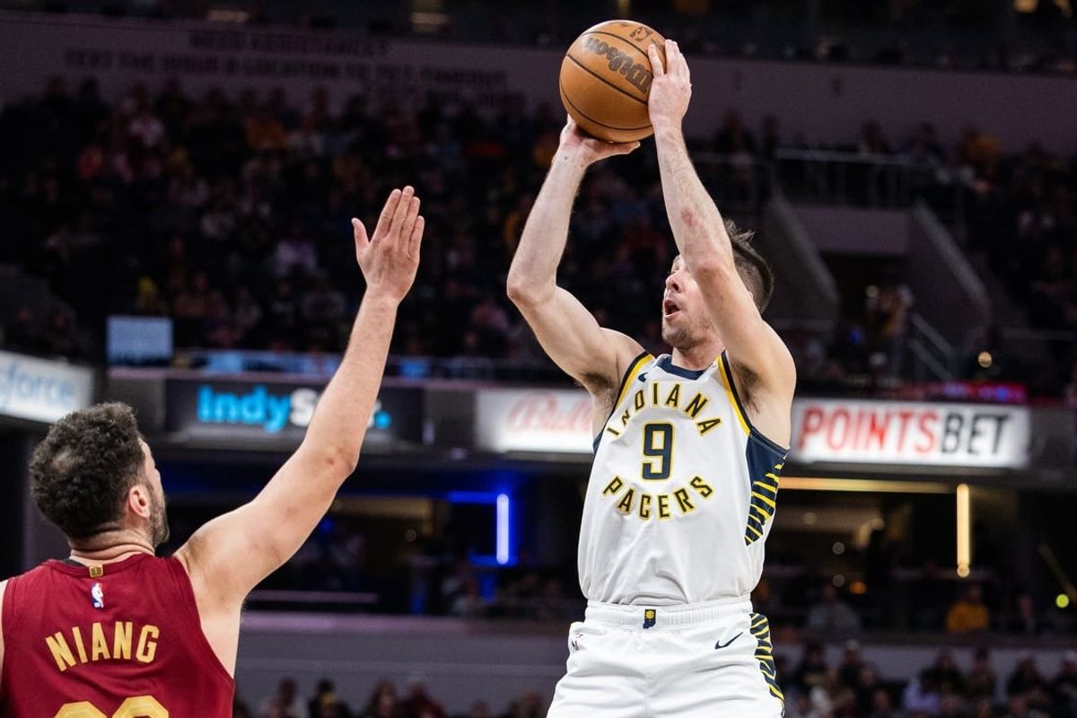 Mar 18, 2024; Indianapolis, Indiana, USA; Indiana Pacers guard T.J. McConnell (9) shoots the ball while Cleveland Cavaliers forward Georges Niang (20) defends in the first half at Gainbridge Fieldhouse.