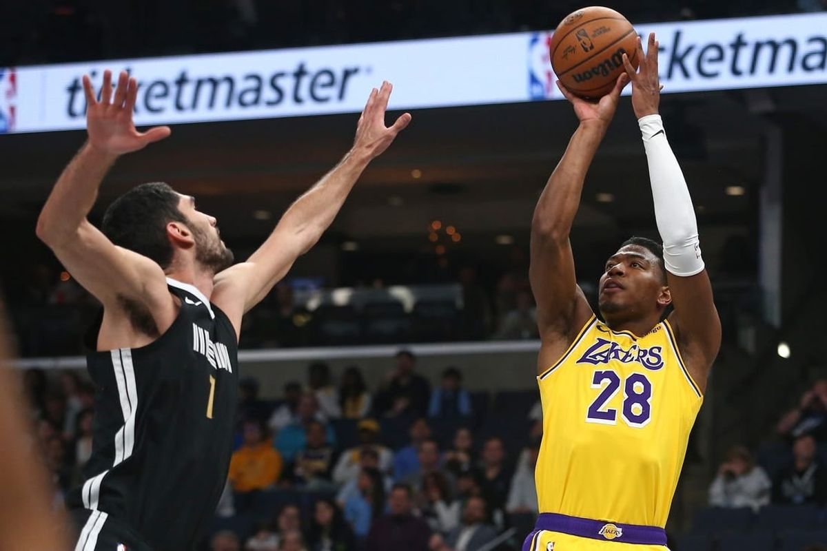 Mar 27, 2024; Memphis, Tennessee, USA; Los Angeles Lakers forward Rui Hachimura (28) shoots as Memphis Grizzlies forward-center Santi Aldama (7) defends during the first half at FedExForum.