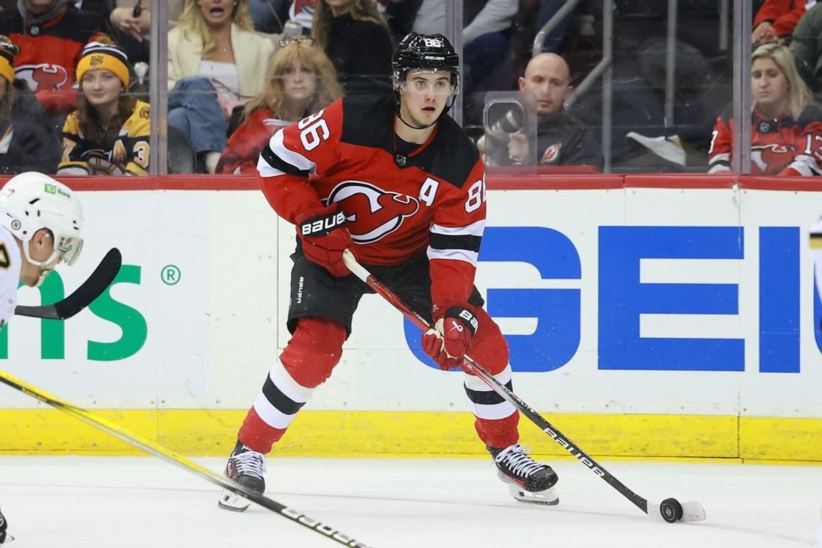 Dec 13, 2023; Newark, New Jersey, USA; New Jersey Devils center Jack Hughes (86) skates with the puck during the third period against the Boston Bruins at Prudential Center.