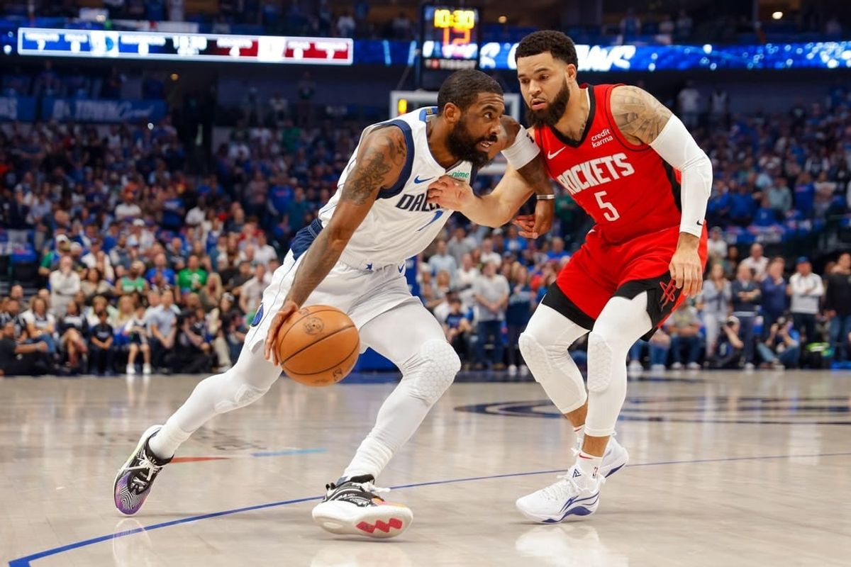 Apr 7, 2024; Dallas, Texas, USA; Dallas Mavericks guard Kyrie Irving (11) drives around Houston Rockets guard Fred VanVleet (5) during the first quarter at American Airlines Center.