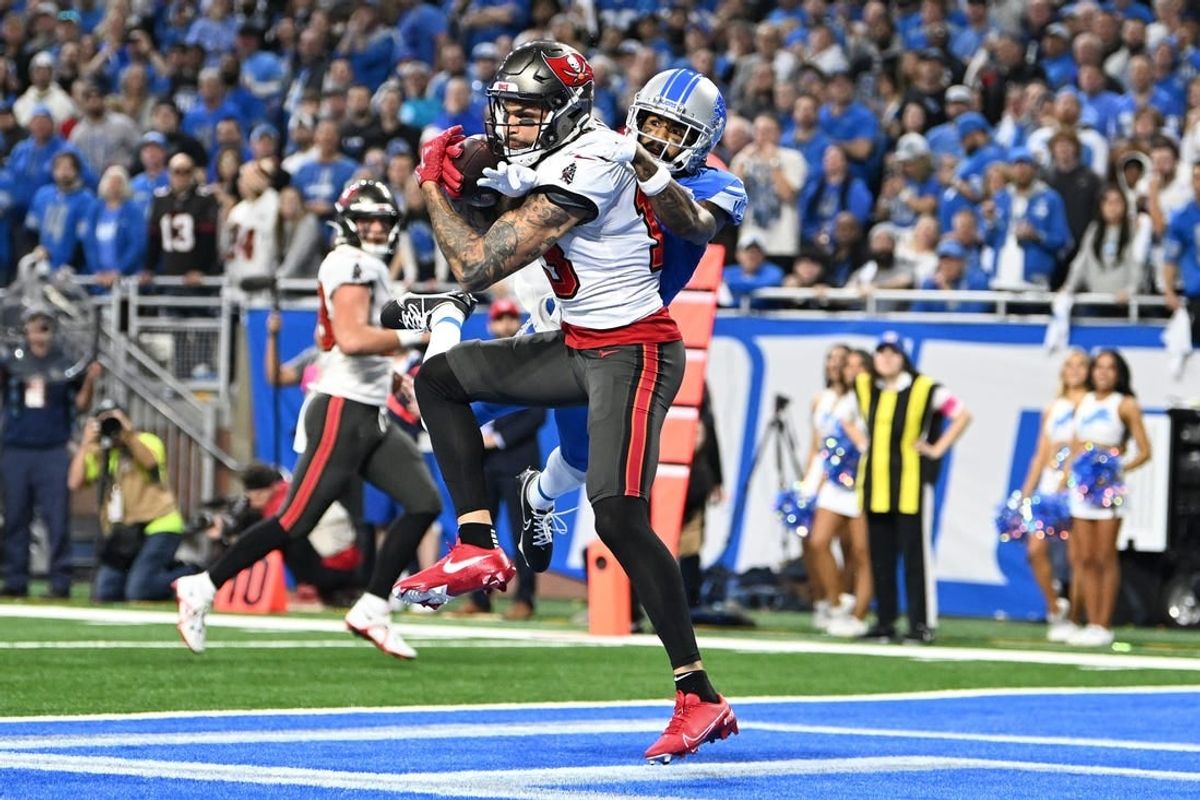 Jan 21, 2024; Detroit, Michigan, USA; Tampa Bay Buccaneers wide receiver Mike Evans (13) makes a catch against Detroit Lions cornerback Cameron Sutton (1) during the second half in a 2024 NFC divisional round game at Ford Field.