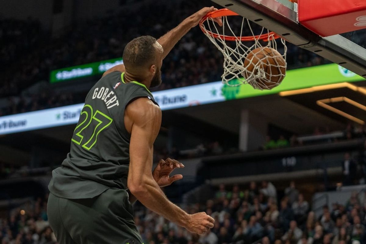 Apr 2, 2024; Minneapolis, Minnesota, USA; Minnesota Timberwolves center Rudy Gobert (27) dunks the ball over Houston Rockets forward Jeff Green (32) in the second quarter at Target Center.