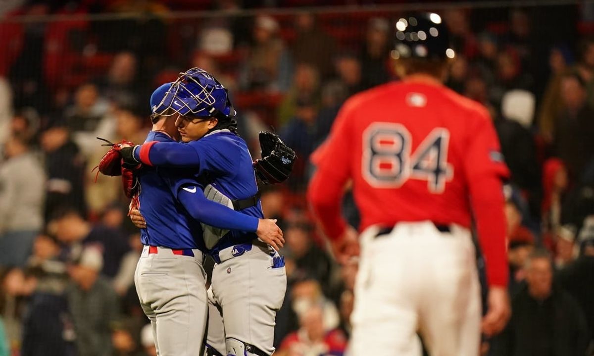 Apr 26, 2024; Boston, Massachusetts, USA; Chicago Cubs relief pitcher Keegan Thompson (71) and catcher Miguel Amaya (9) react after defeating the Boston Red Sox in nine innings at Fenway Park.