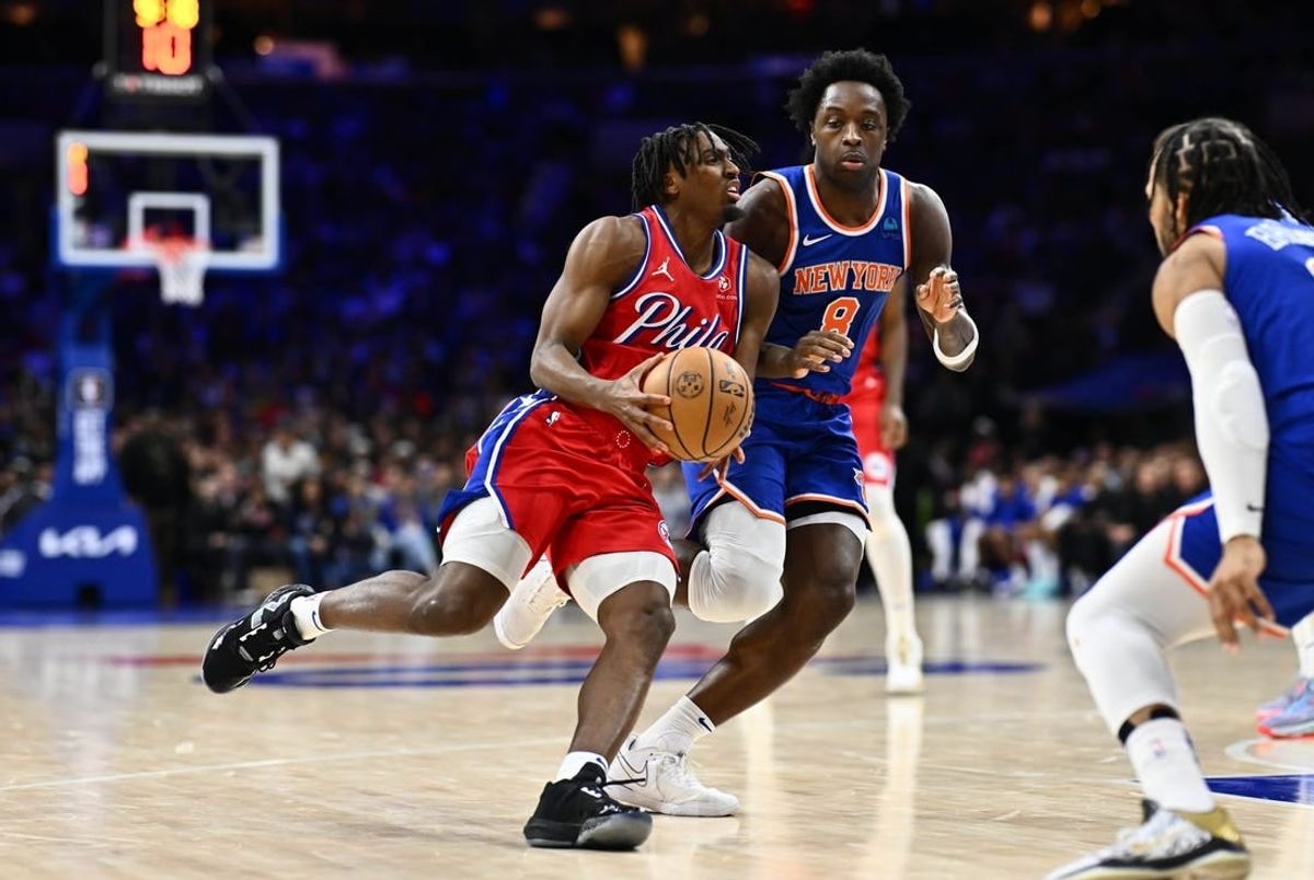 Jan 5, 2024; Philadelphia, Pennsylvania, USA; Philadelphia 76ers guard Tyrese Maxey (0) drives against New York Knicks forward OG Anunoby (8) in the fourth quarter at Wells Fargo Center.