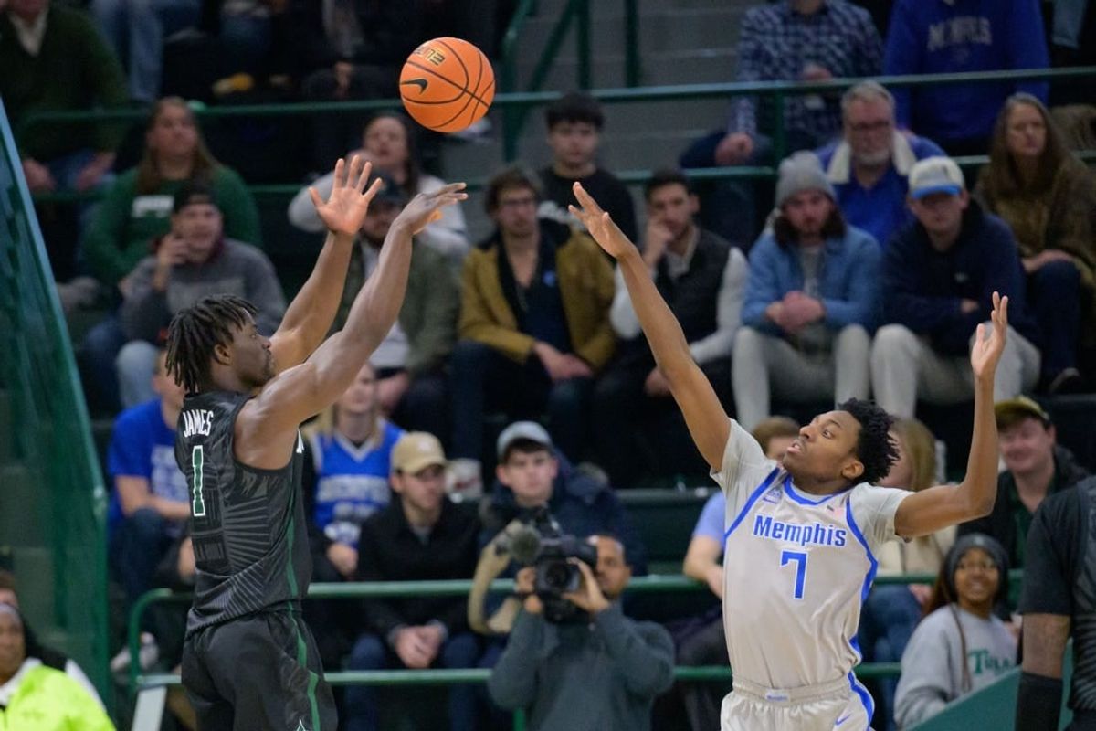 Jan 21, 2024; New Orleans, Louisiana, USA; Tulane Green Wave guard Sion James (1) shoots over Memphis Tigers forward Nae'Qwan Tomlin (7) during the first half at Avron B. Fogelman Arena in Devlin Fieldhouse.