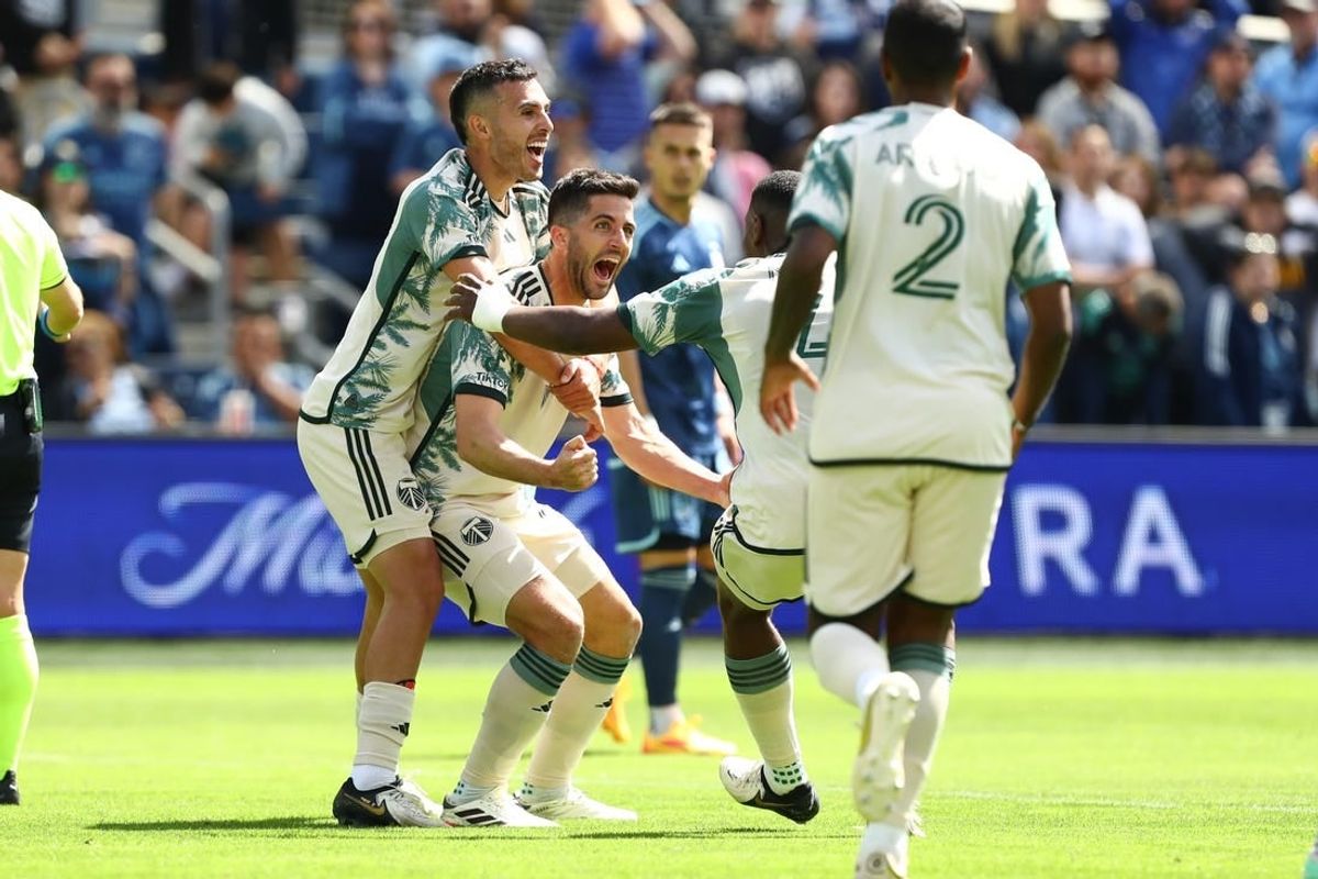 Apr 7, 2024; Kansas City, Kansas, USA; Portland Timbers defender Eric Miller (15) celebrates with teammates after scoring a goal against Sporting Kansas City during the second half at Children's Mercy Park.