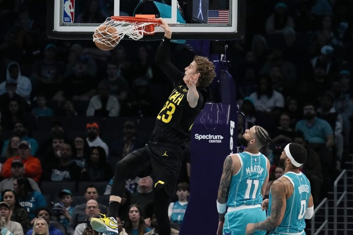 Jan 27, 2024; Charlotte, North Carolina, USA; Utah Jazz forward Lauri Markkanen (23) makes a dunk against the Charlotte Hornets during the second quarter at Spectrum Center.