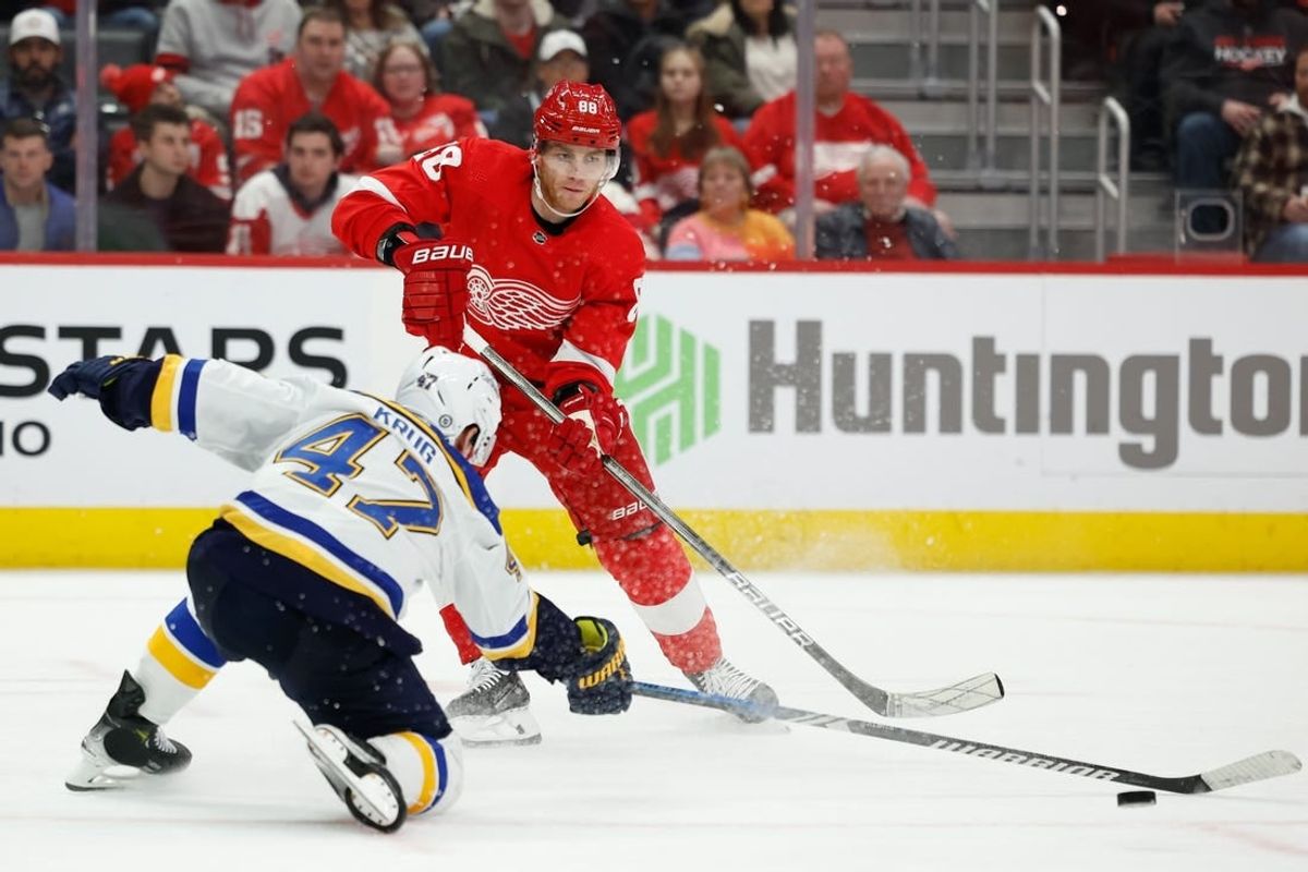 Feb 24, 2024; Detroit, Michigan, USA;  Detroit Red Wings right wing Patrick Kane (88) skates with the puck defended by St. Louis Blues defenseman Torey Krug (47) in the third period at Little Caesars Arena.