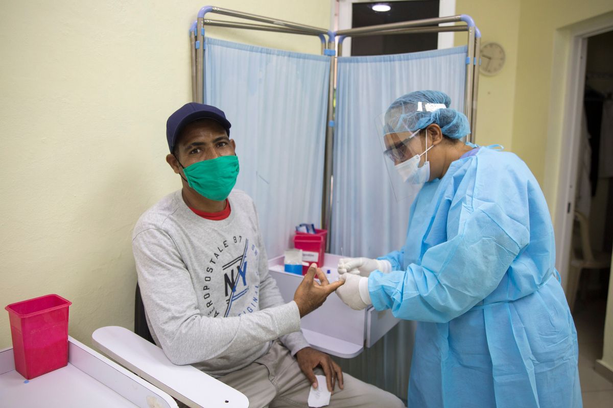 A man gets a COVID-19 rapid test at a field hospital in La Vega, Dominican Republic, which has seen over 15,000 confirmed cases.
