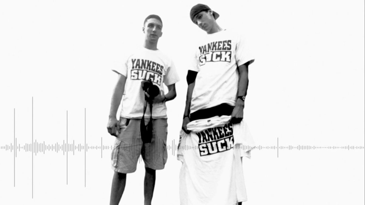 Ray LeMoine, left, selling “Yankees Suck” shirts outside of Fenway Park.