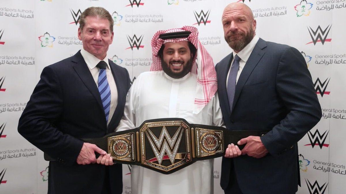 Vince McMahon, Turki bin Abdel Muhsin Al-Asheik of Saudi Arabia’s General Sports Authority, and Paul “Triple H” Levesque.