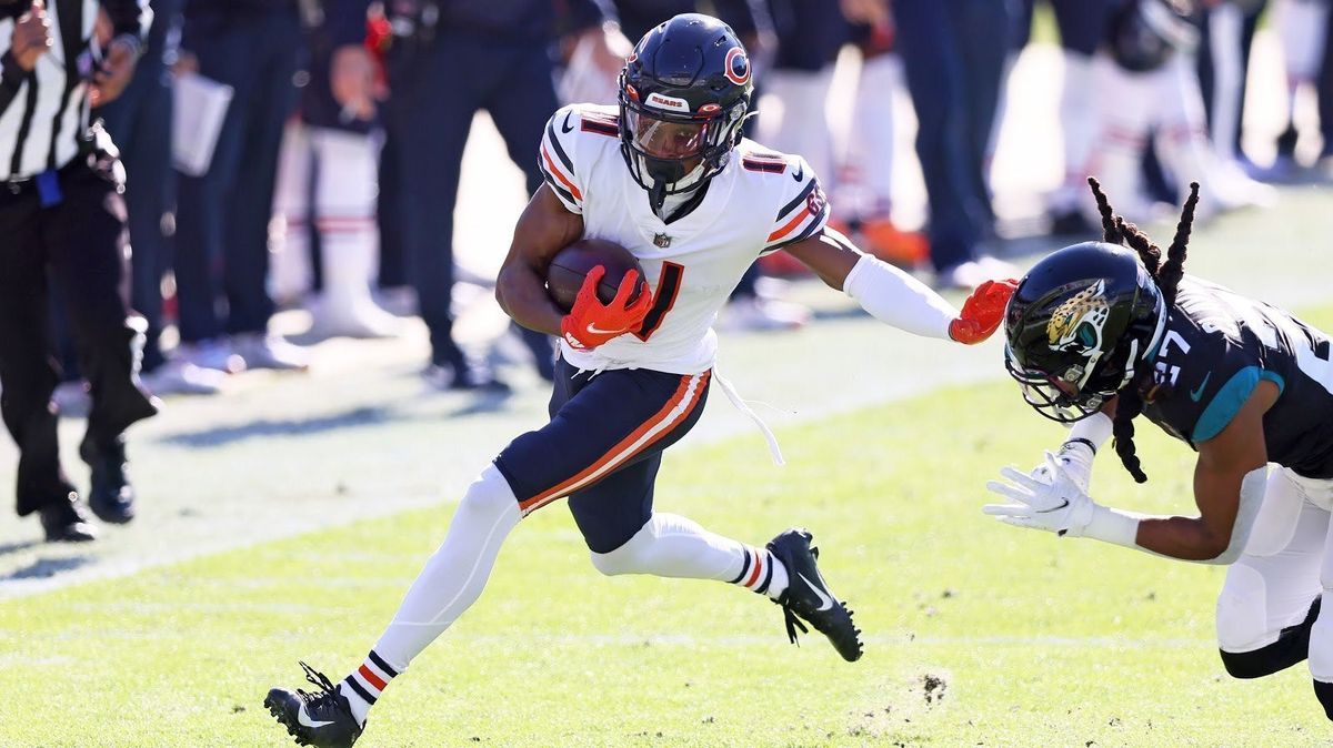 Bears receiver Darnell Mooney stiff arms a Jags’ defender, to the delight of Jags fans.