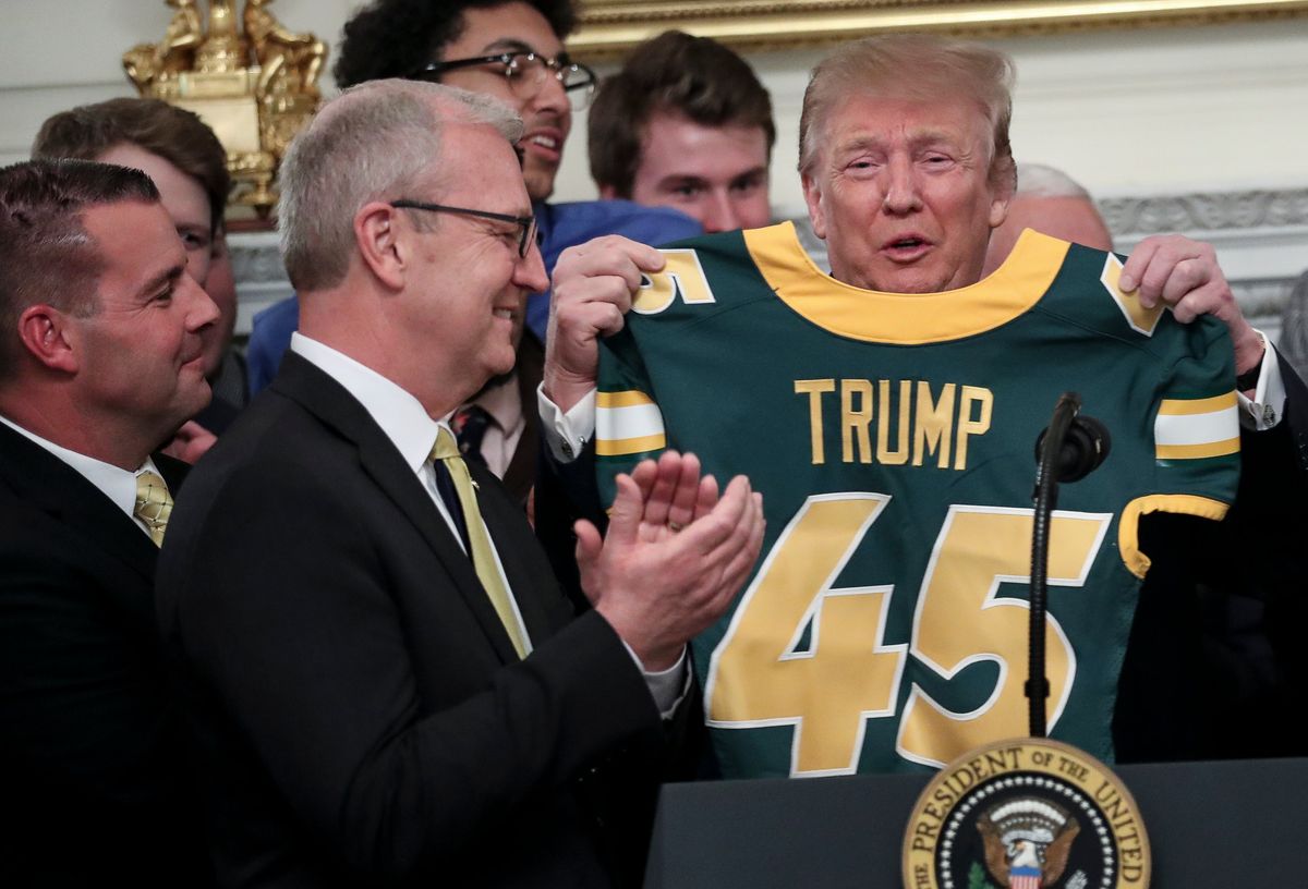 North Dakota State presents Trump with a custom jersey last year at the White House.