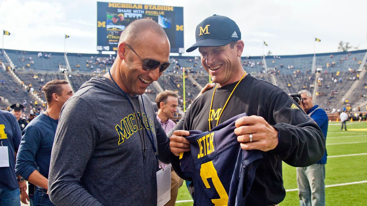 Derek Jeter and Jim Harbaugh presumably discuss fashion in September, 2015. Photo credit:  [object Object]