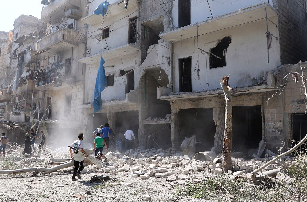 Photo via  [object Object] : Search and rescue team members inspect the debris of buildings after Russian army aircrafts hit residential areas at Sukkari district of Aleppo, Syria on September 07, 2016.