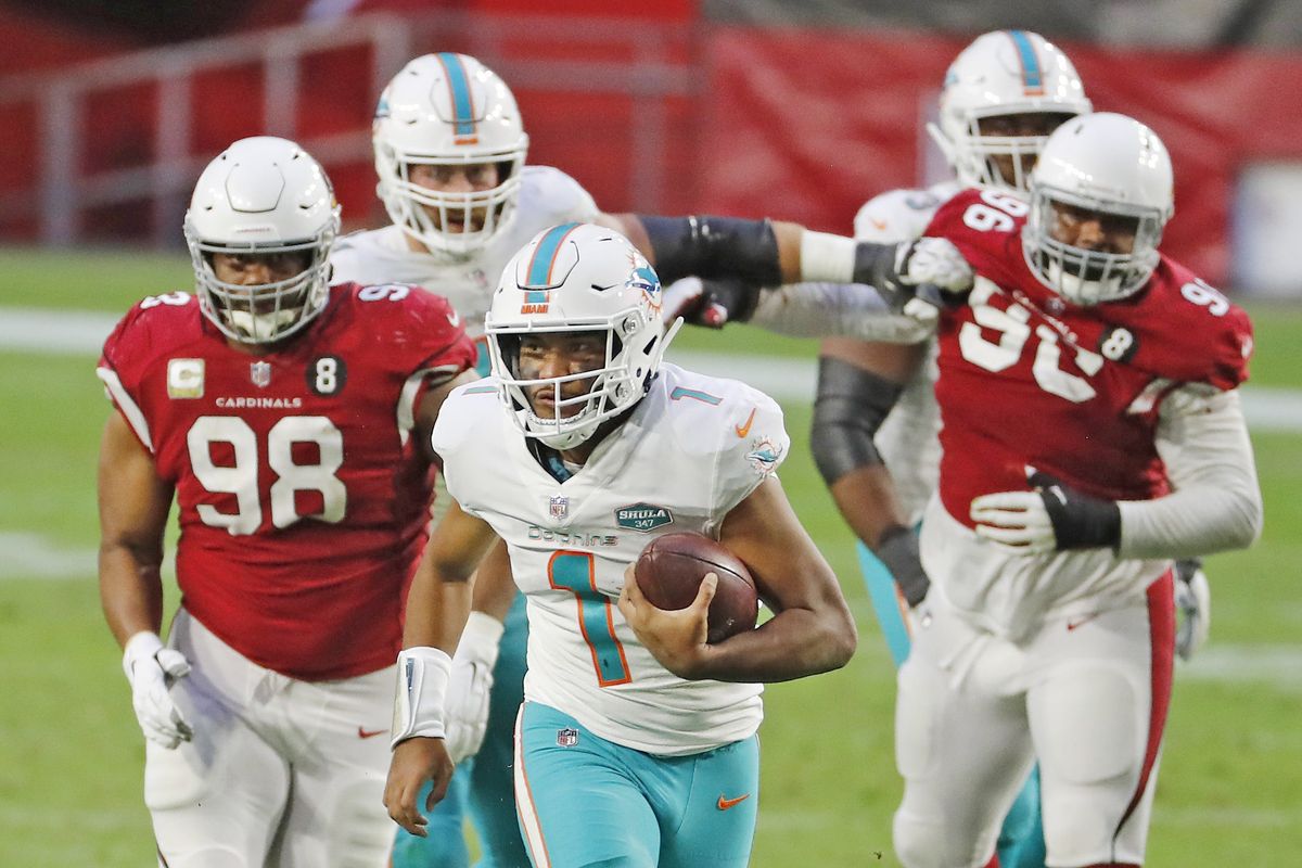 Tua Tagovailoa runs away from the Cards, as Fins keep rolling with him under center.