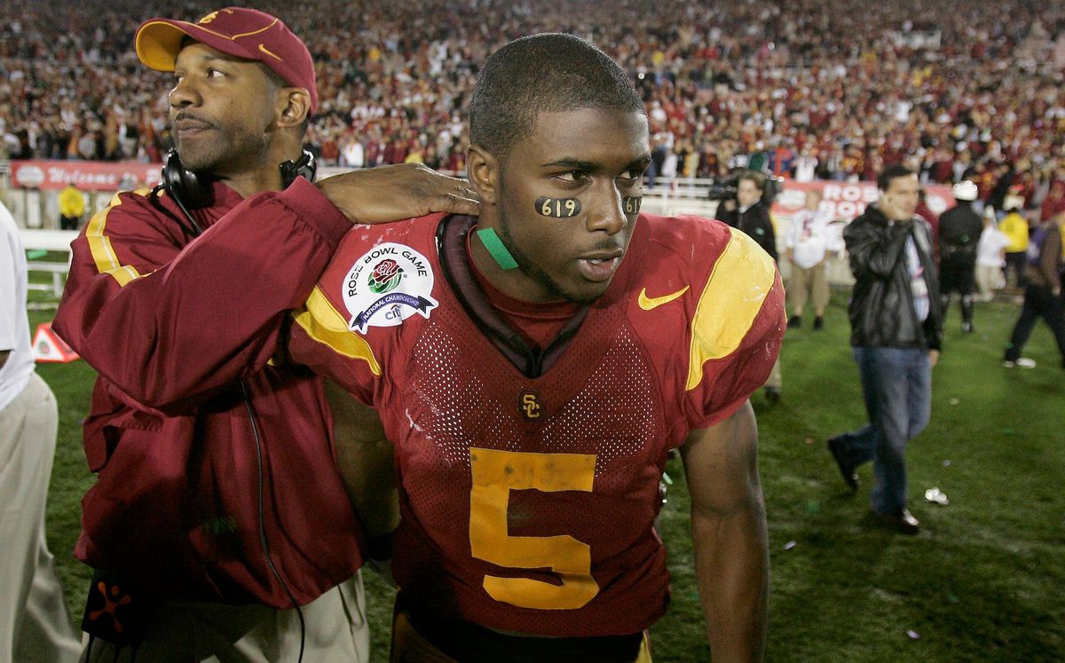 Todd McNair and Reggie Bush after losing to Texas in the 2006 Rose Bowl. (Photo Credit:  [object Object] /Chris Carlson.)
