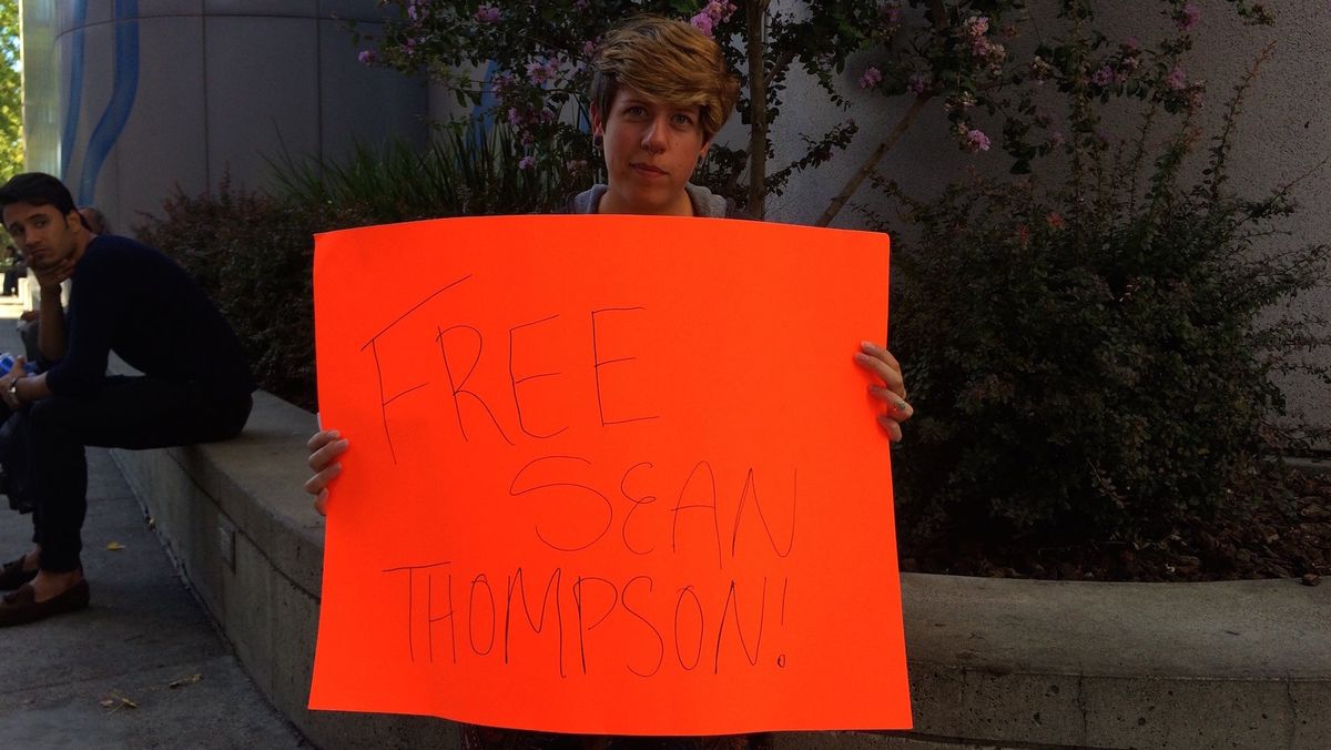 Sacramento citizen Kayla protests Sean Thompson being in jail for pieing Kevin Johnson; photo via the author