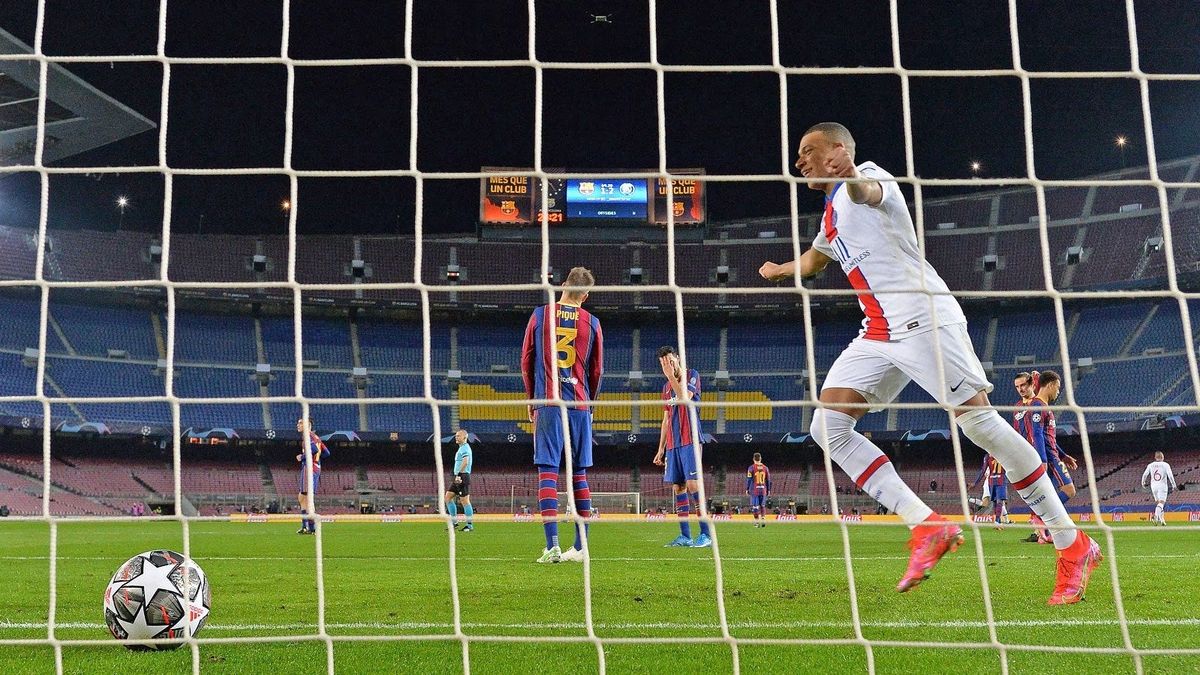Paris Saint-Germain’s French forward Kylian Mbappe celebrates after scoring o ne of his three  goals agai nst Barcelo na.