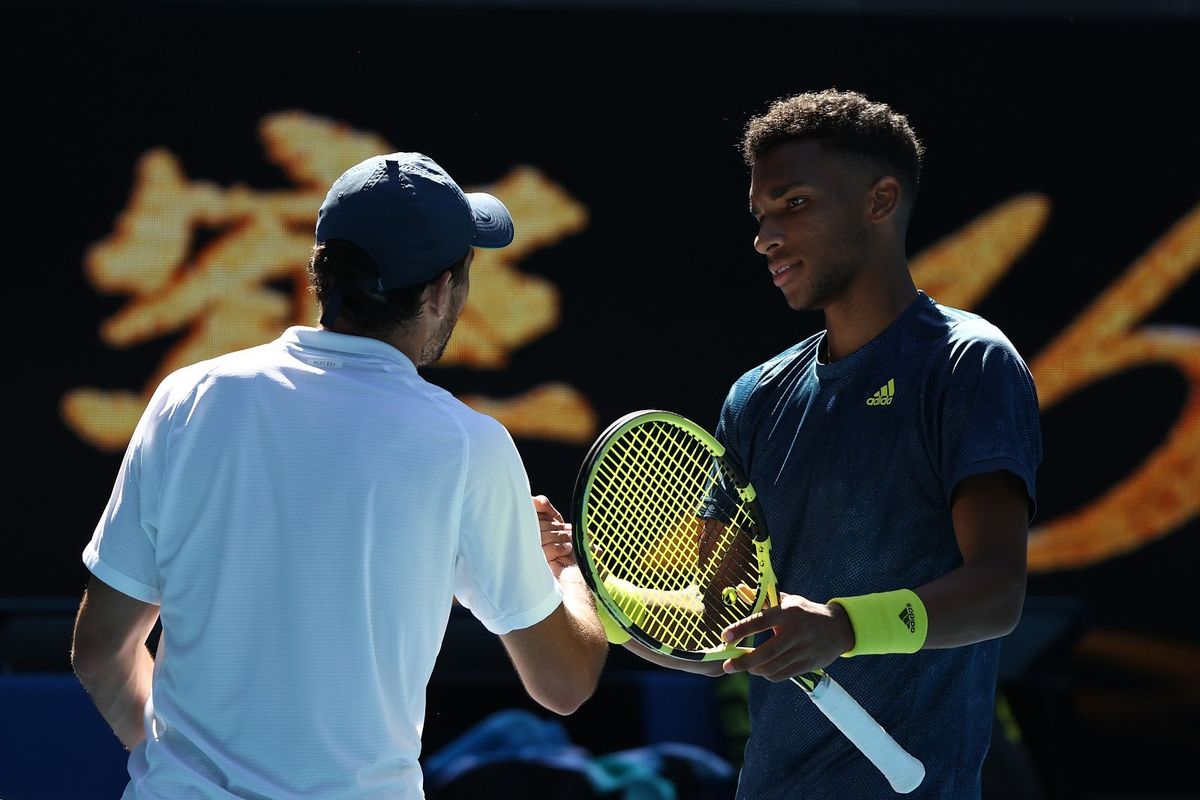 Aslan Karatsev (l.) pulled out a comeback Sunday after finding himself down two sets against Felix Auger-Aliassime (r.).
