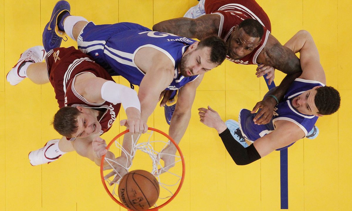 Like Twitter user @T_nels, Timofey Mozgov dunks on Andrew Bogut. (Photo credit: Marcio Jose Sanchez/ [object Object] )