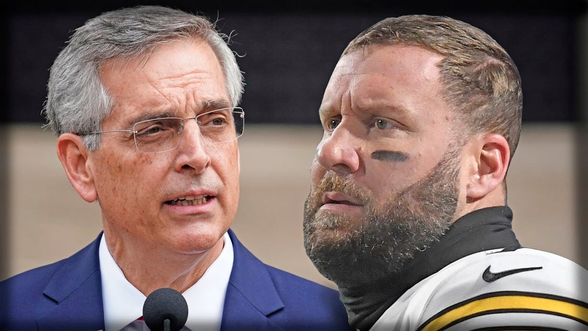 One wears a tie, the other a helmet.