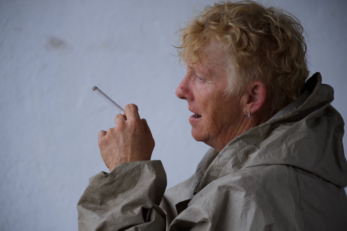 Trainer  Hazel Copeland  takes a drag from her cigarette