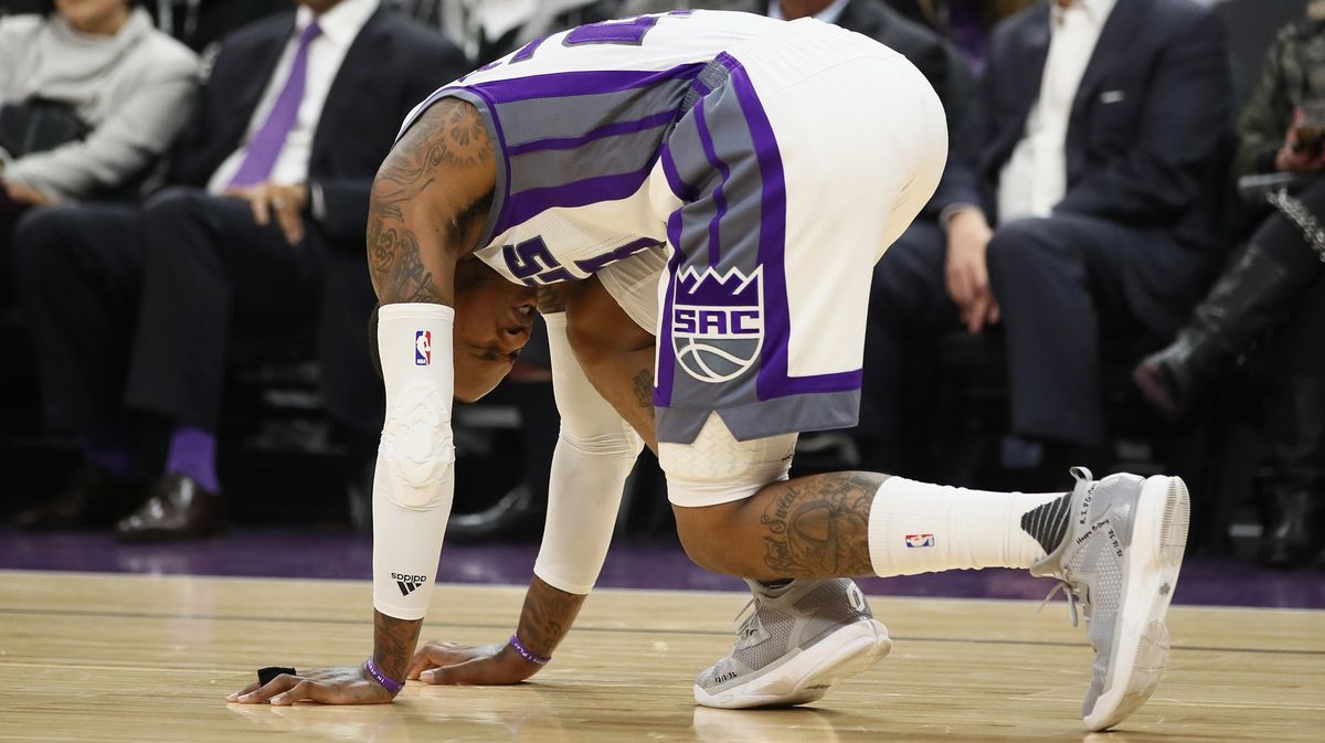 For added discomfort, the guy in the purple socks and tie is... Kevin Johnson!