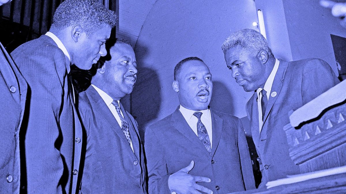 Dr. Martin Luther King Jr. with  boxer Floyd Patterson, left, former baseball player Jackie Robinson, right, and civil rights leader Rev. Ralph D. Abernathy, second from left, in 1963.