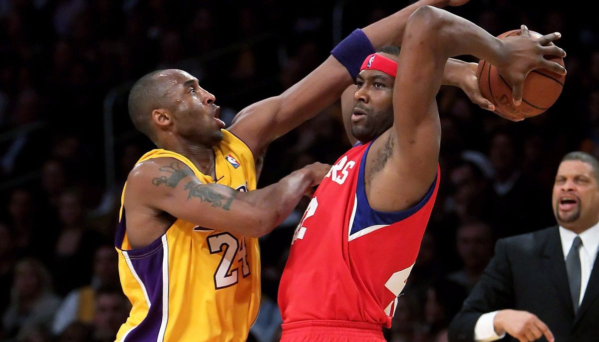A photo of Elton Brand and some guy, via  [object Object]