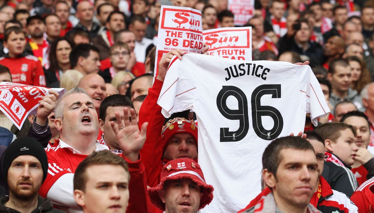 A Liverpool supporter holds up a ‘Justice for the 96' jersey at a 2012 FA Cup match. (Photo credit: Scott Heavy/ [object Object] )
