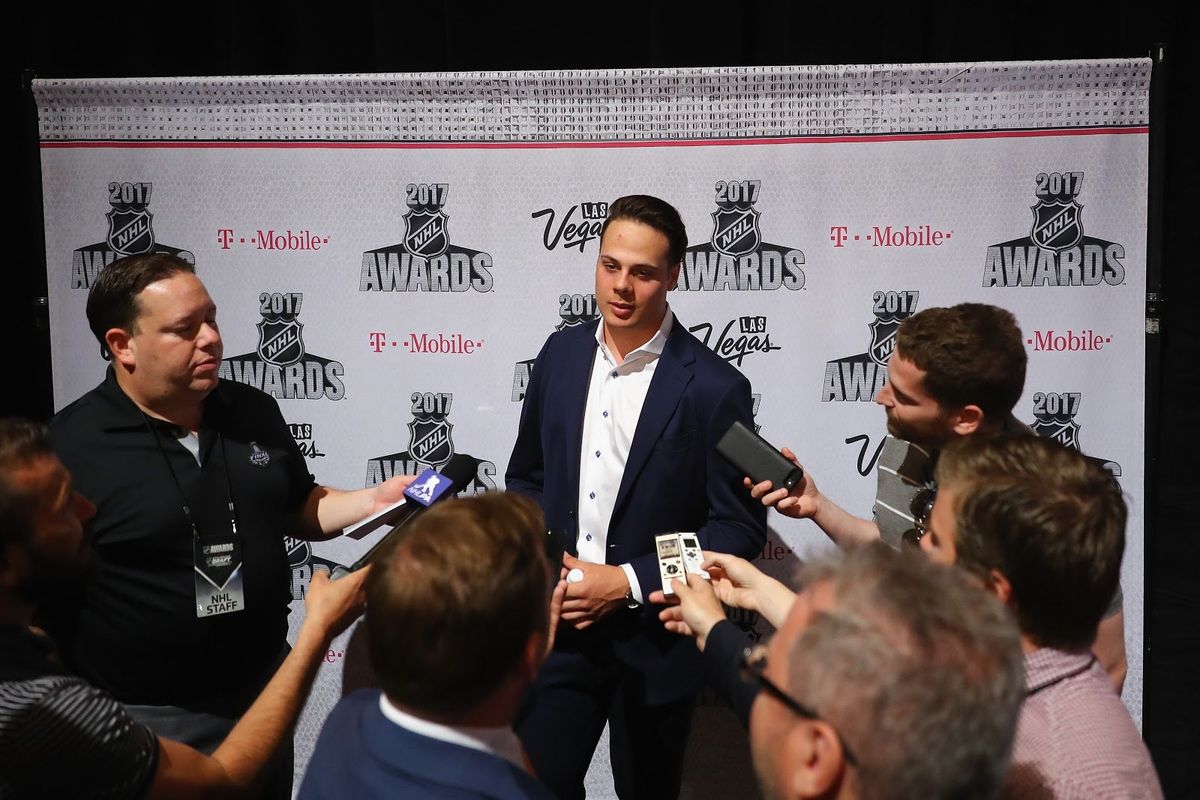 Auston Matthews surrounded by the overwhelmingly white, male press who cover the NHL.