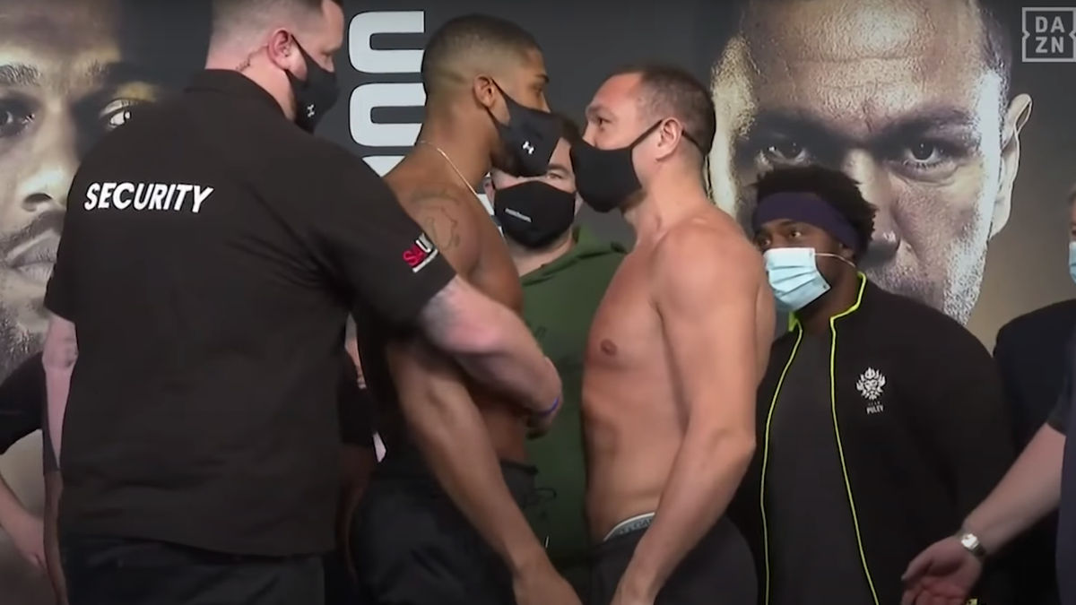 A ntho ny Joshua, left, a nd Kubrat Pulev got awfully touchy i n their weigh-i n.
