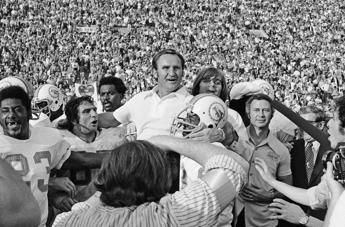 Don Shula is carried off the field after leading the Dolphins to the NFL’s only perfect season.