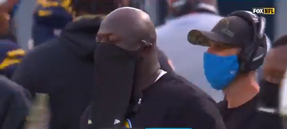 Chargers’ coach Keith Burns sports a pair of shorts over his facial area.