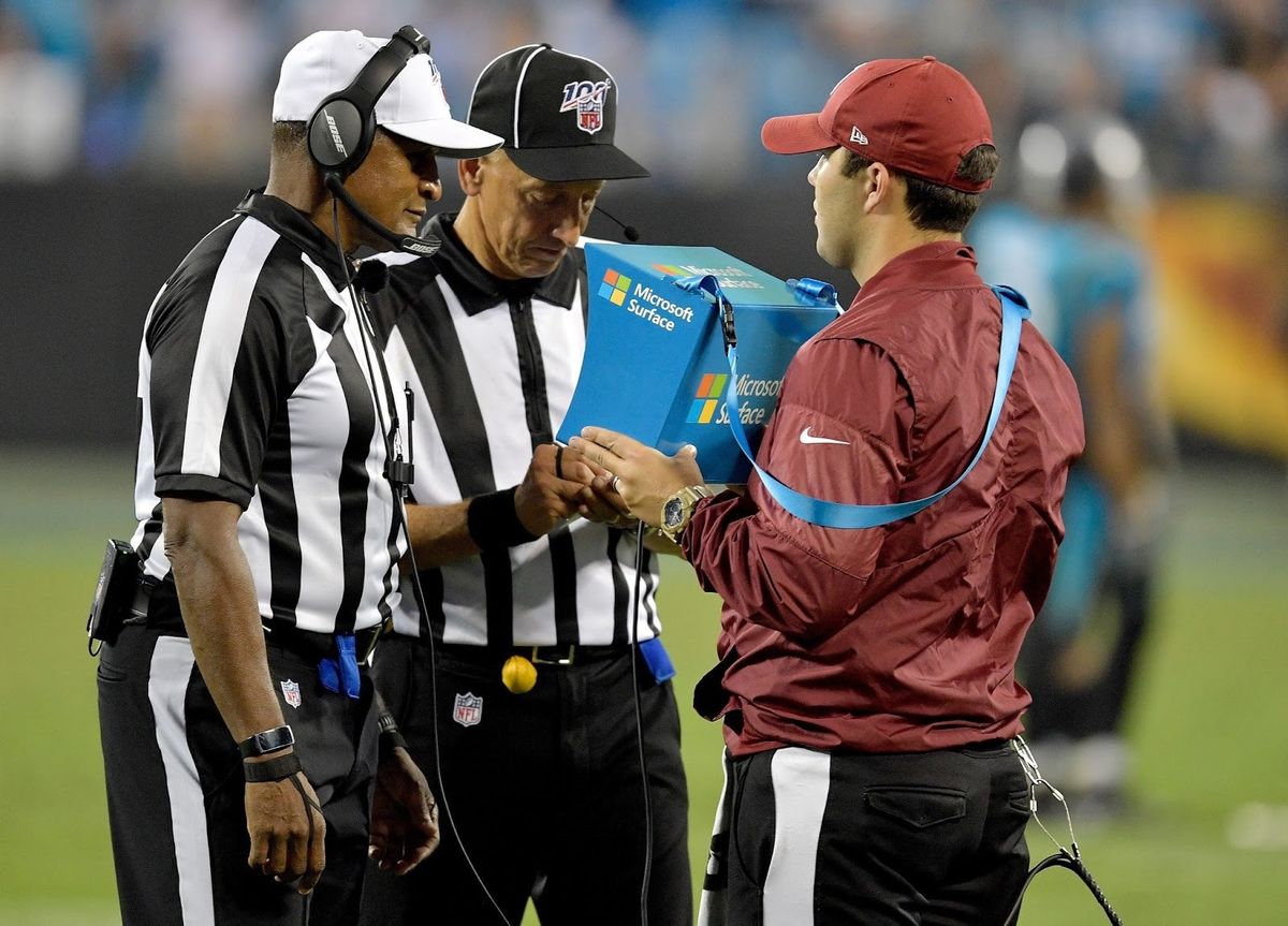 NFL officials  Jerome Boger and Tony Steratore gaze into the replay box.