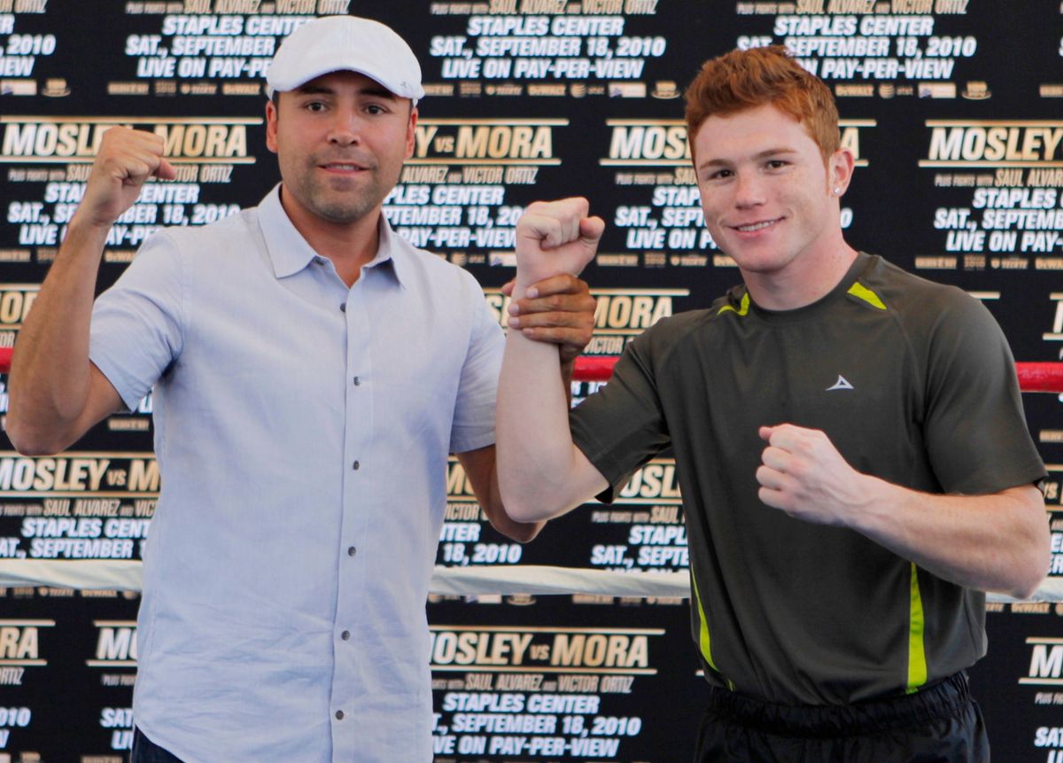 Oscar De La Hoya and “Canelo” Álvarez in 2010. Photo by Damian Dovarganes/AP