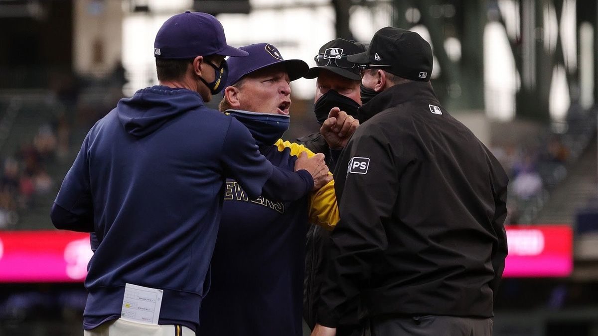 Bench coach Pat Murphy of the Milwaukee Brewers argues a call with umpire Marty Foster during the fourth inning of a game against the Miami Marlins.