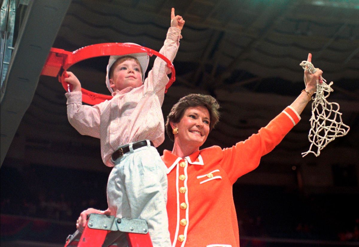 Summitt and son Tyler cut down the net after winning the championship in 1996. (Pat Sullivan/ [object Object] )