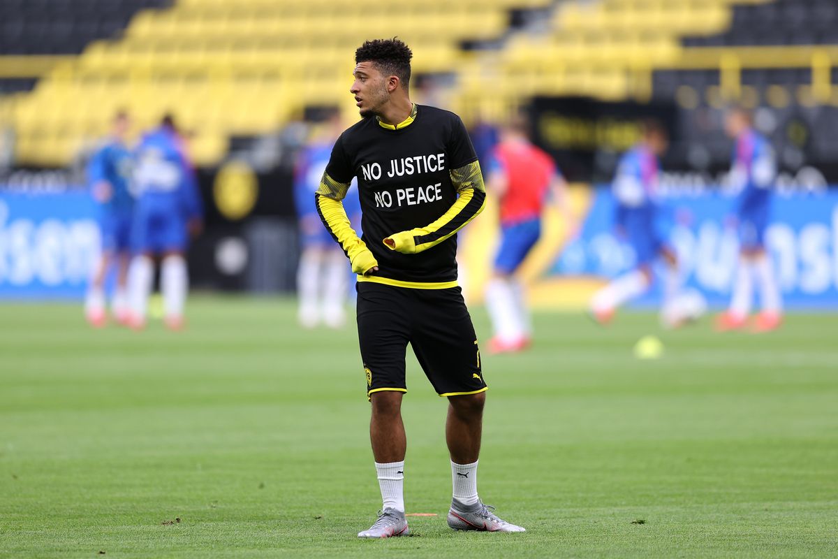 Jadon Sancho of Borussia Dortmund wears a No Justice No Peace T-Shirt prior to the Bundesliga match.