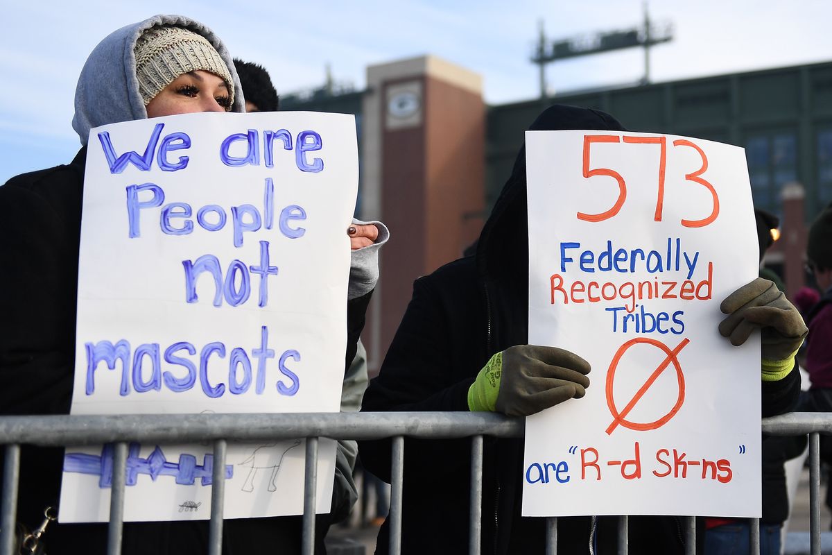 Protesters denounce the racist name of the NFL’s Washington team.