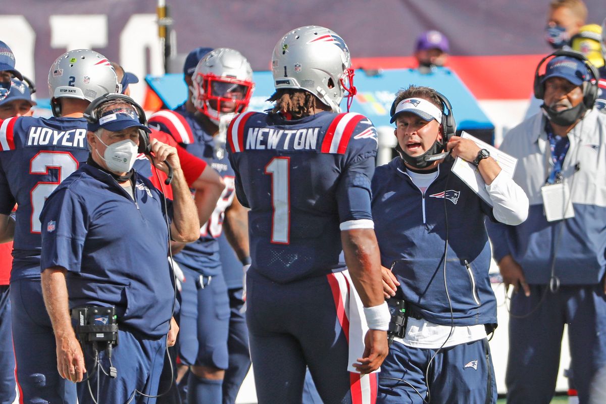 Future king Josh McDaniels instructs Cam Newton as Bill Belichick looks on.