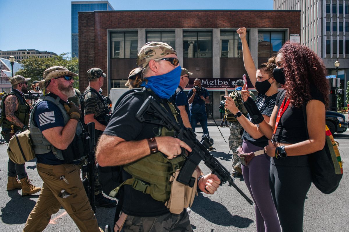 Armed right-wing groups staged a counter protest to activists demanding justice for Breonna Taylor at the Kentucky Derby.