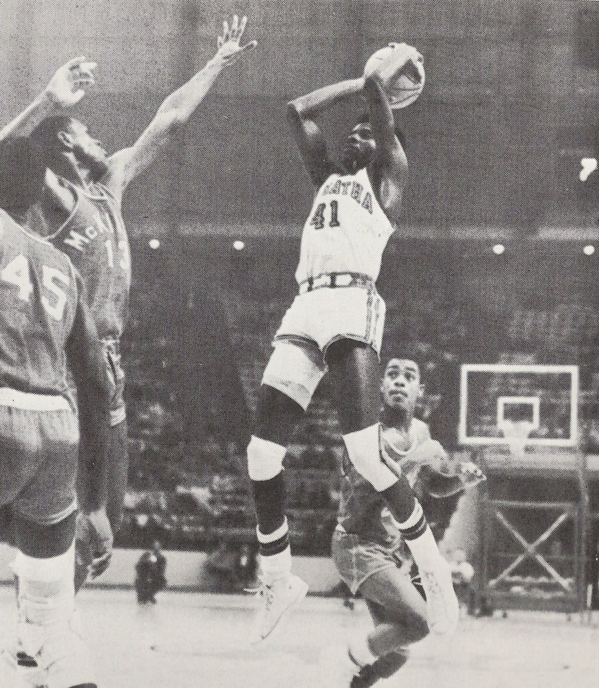 DeMatha’s James Brown shooting over future NBA vet Tim Bassett of rival McKinley Tech in 1969 game.
