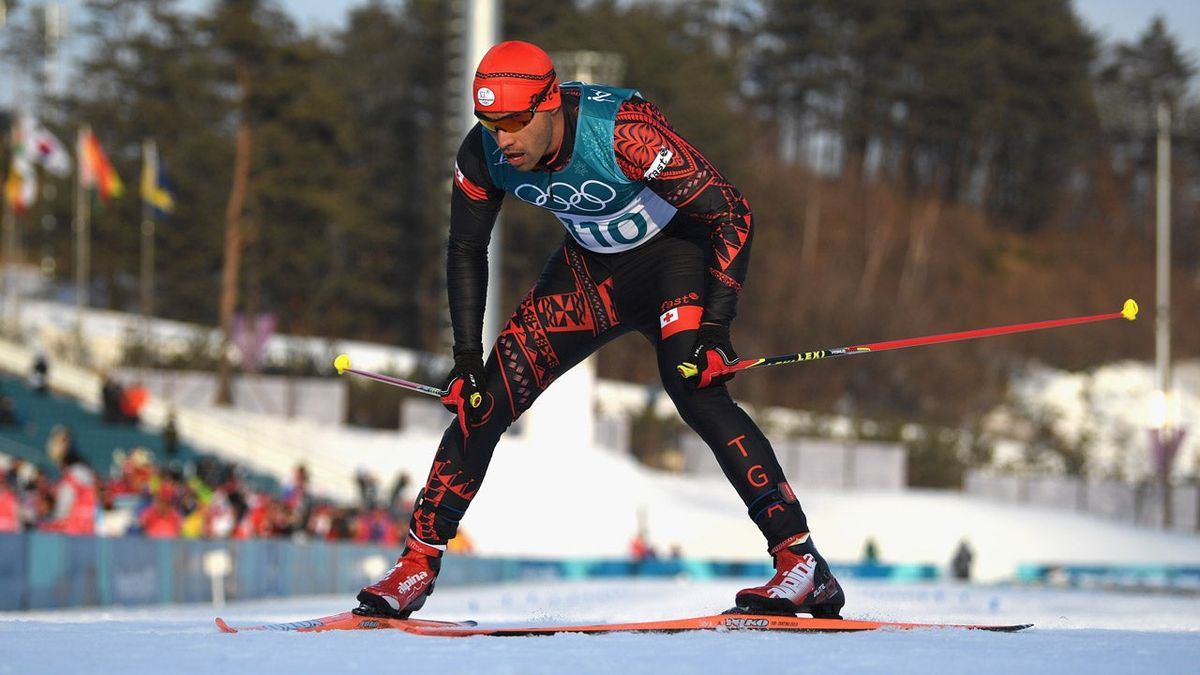 Pita Taufatofua crosses the finish line in the 15 kilometer cross-country freestyle. (Photo: Matthias Hangst/ [object Object] (