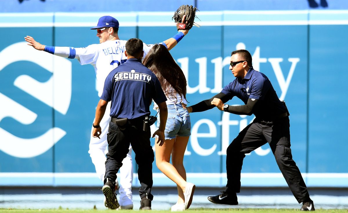 A fan goes in for the hug during Sunday’s Dodgers game.